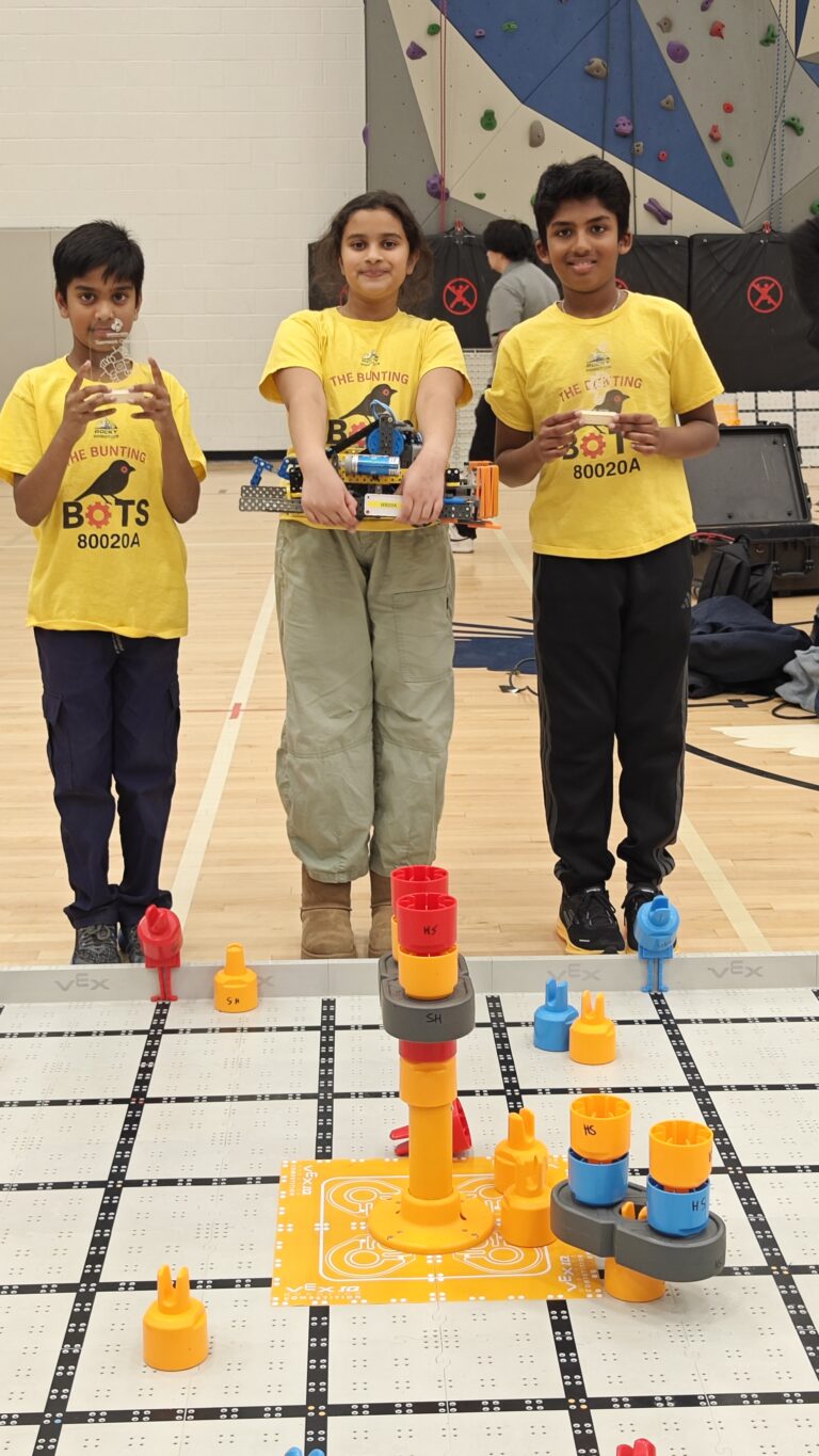 Bunting Bots students with Teamwork Champion and Innovate award trophies