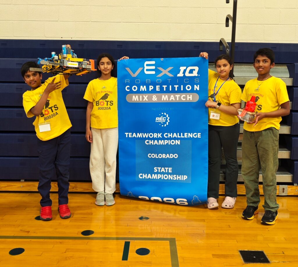 The Bunting Bots with the Colorado VEX IQ State Championship banner